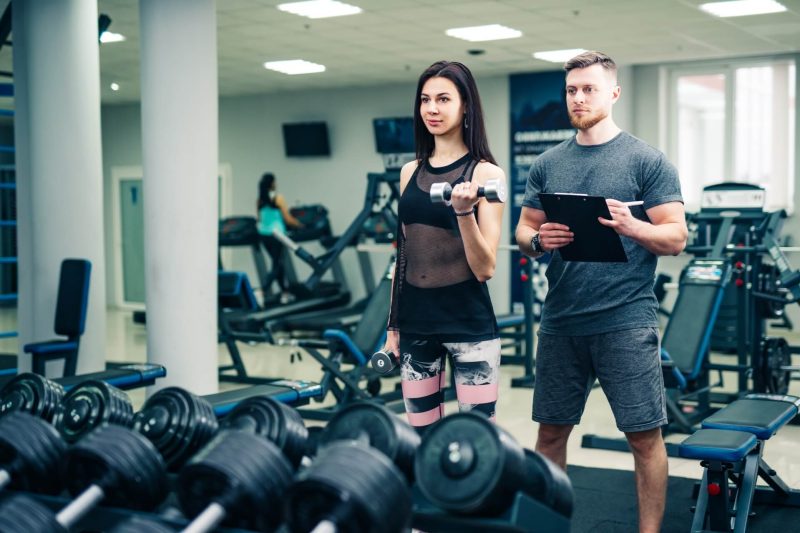 personal-trainer-helping-woman-working-with-heavy-dumbbells-personal-fitness-instructor-personal-training-800x533 personal-trainer-helping-woman-working-with-heavy-dumbbells-personal-fitness-instructor-personal-training-800x533